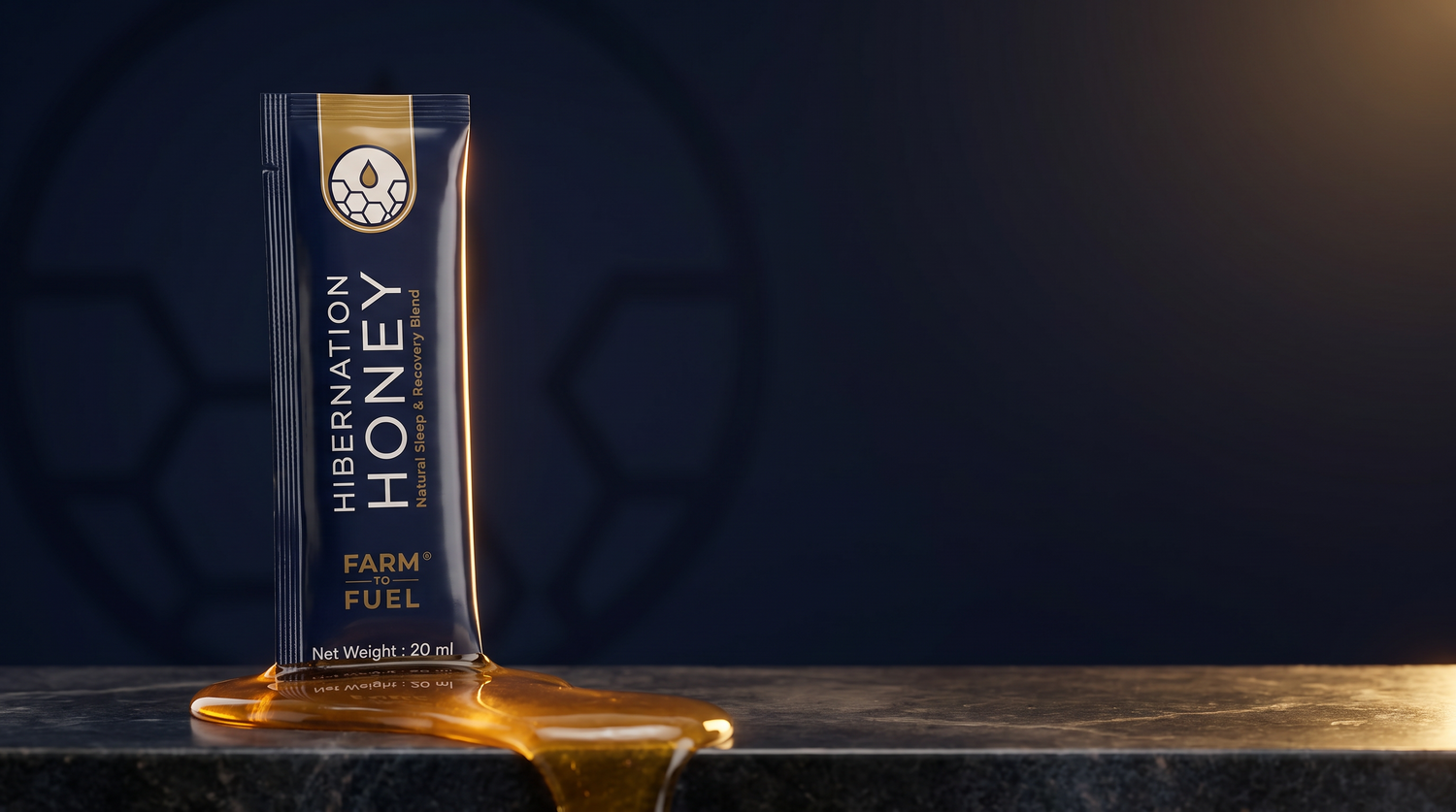 Hibernation Honey stick pack standing in a pool of raw honey on a dark marble ledge